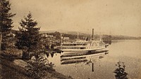 Lake George, New York: the Horicon paddle-steamer showing a clear reflection in the water. Photograph, ca. 1880.