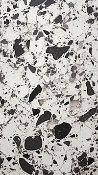 Black and white terrazzo with some paint on it floor paper backgrounds.