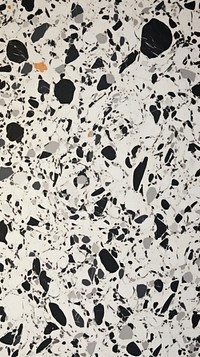 Black and white terrazzo with some paint on it flooring backgrounds splattered.