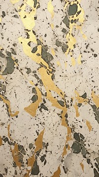 Gold terrazzo pattern with some paint on it abstract plaster texture.