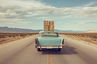 Classic car with boxes on top vehicle road transportation.