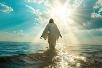 Photo of jesus walking through ocean surface sky sunlight standing.