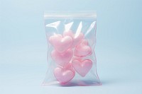 Heart candy in plastic bag transparent symbol petal.