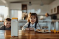 Milk carton bottle table child.