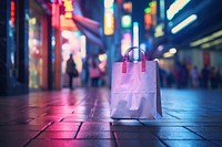 2 white paper shopping bag on the floor street handbag night infrastructure.
