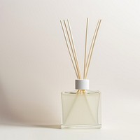A reed diffuser bottle perfume glass white background.