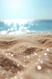 Summer sand beach and bokeh sun light on sea background backgrounds outdoors nature.