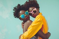 2 black woman hug sunglasses portrait fashion.