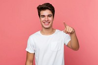 Young man smile pointing t-shirt.