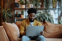 Man working on a laptop computer sitting adult.