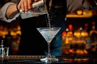 Bartender pouring cocktail drink bartender martini.