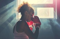 Woman getting ready for boxing practice punching sports adult.