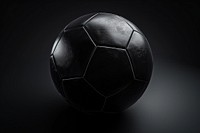 Black soccer ball on a black background football sports monochrome.