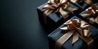 Christmas presents with gold ribbon on a black background gift celebration anniversary.