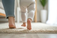 Toddler white flooring barefoot.