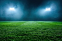 Green football feild with 2 open spotlights outdoors stadium nature.