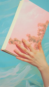 Hand with book art painting publication.