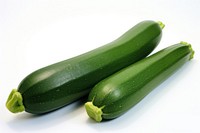 Two courgettes vegetable zucchini squash.