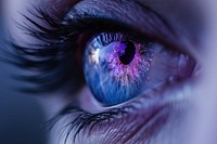 Purple and blue eye with the word blue eyes portrait darkness.