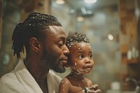 African American father and son shaving photography portrait bathroom.