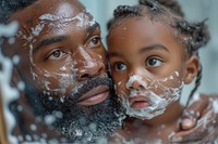 African American father photography portrait bathing.