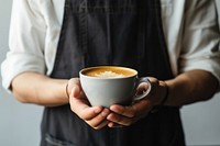 Coffee shop worker with hand drip coffee drink cup mug.