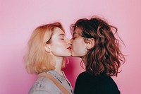 Women couple kissing adult affectionate togetherness.