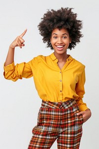Afro woman points away on copy space smile cheerful blouse.