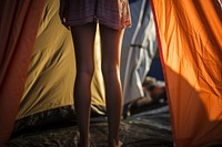Close up leg woman standing against tent outdoors camping adult.