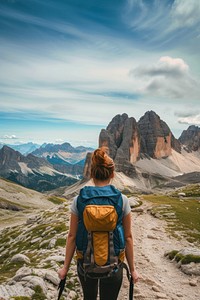 Woman hiking in the mountains backpacking adventure travel.