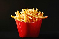 French fries food black background condiment.