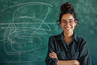 Smiling female teacher blackboard education classroom.