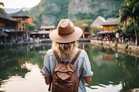 A Young tourist happily takes photos travel adult architecture.