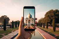 Smartphone screen of Taj Mahal video in India travel adult photo.