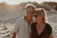 Middle-aged couple walking together portrait glasses summer.