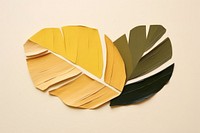 Abstract golden plant ripped paper art leaf publication.