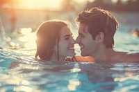 Boyfriend and girlfriend enjoying together in swimming pool portrait outdoors sports.
