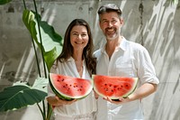 Happy middle-aged couple melon watermelon holding.