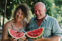 Middle-aged couple laughing watermelon holding summer.