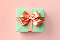 Pink gift with bright orange bow ribbon green anniversary.