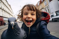 Pigeon and kid laughing portrait smiling.