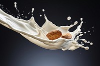 Milk splash with almonds milk food refreshment.