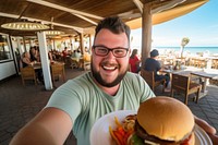 Man chubby happy face restaurant portrait hamburger.