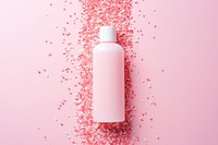 Body lotion package on pink water pattern cosmetics bottle celebration.