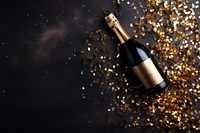 Celebration background with golden champagne bottle celebration confetti drink.