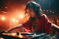 Asian woman DJ headphones turntable nightclub.