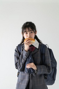 Japanese female student holding adult bread.