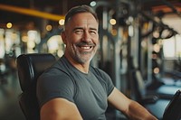Middle age man working in gym smile adult determination.