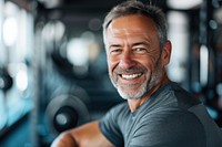 Middle age man working in gym smile adult bodybuilding.