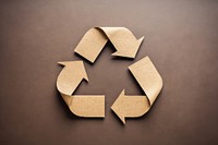 Recycle symbol made of cardboard paper text recycling circle.